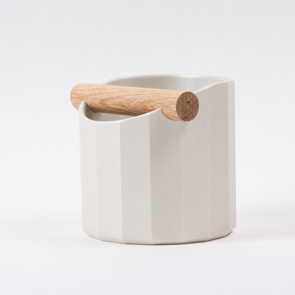 KNOCDIC® Facet Geometric Espresso Knock Box with off-white finish and oak knock bar for coffee tampering.