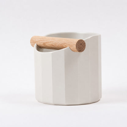 KNOCDIC® Facet Geometric Espresso Knock Box with off-white finish and oak knock bar for coffee tampering.
