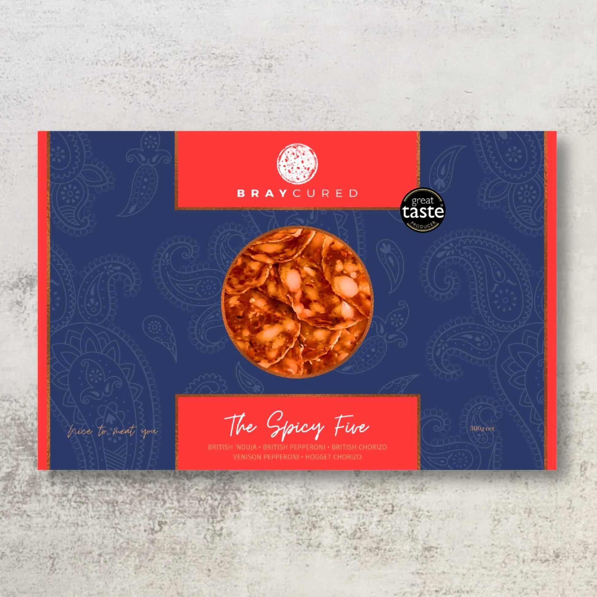 Bray Cured Spicy Feasting Five charcuterie selection with assorted spicy cured meats on a wooden board.