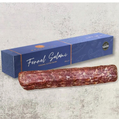 Thinly sliced Bray Cured personal slicing salami with fennel, displayed on a wooden board as part of a charcuterie selection.