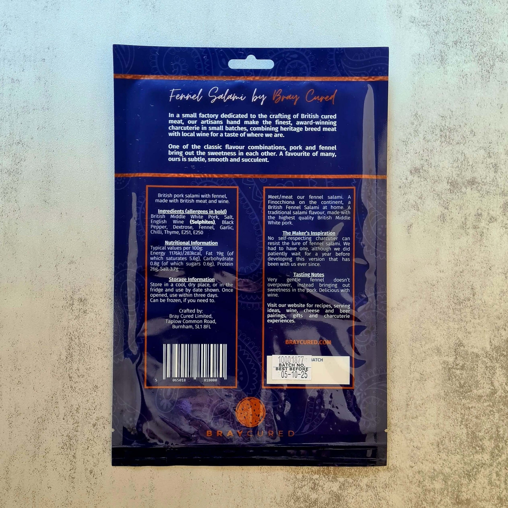 Back view of Bray Cured Fennel Salami charcuterie pack showing sliced fennel salami on a wooden board.