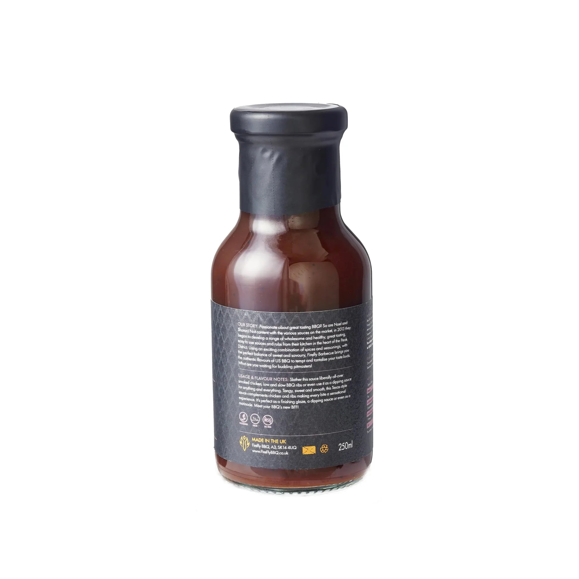 Bottle of FireFly Barbecue Sweet Texas BBQ Sauce with label visible, featuring rich, dark sauce ideal for grilling and dipping.