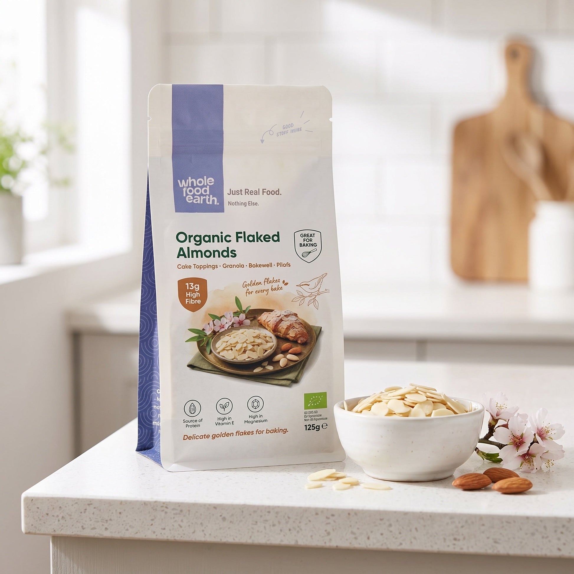 Organic flaked almonds from Whole Food Earth, close-up of light, crunchy almond flakes in a natural setting.