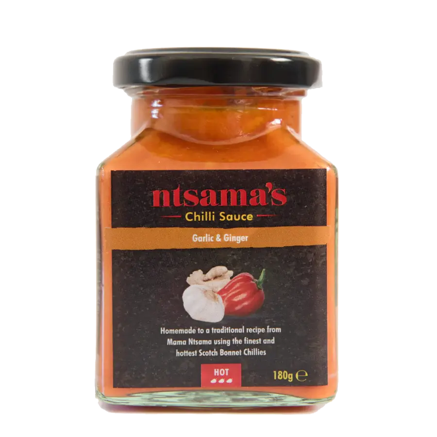 Bottle of Ntsama.co.uk ginger and garlic sauce with fresh ginger and garlic visible on the label.