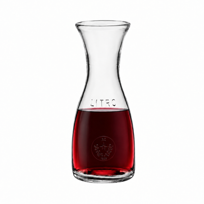 Bormioli Rocco Misura glass carafe with 0.6L capacity, clear glass jug filled with red wine, designed for serving beverages.