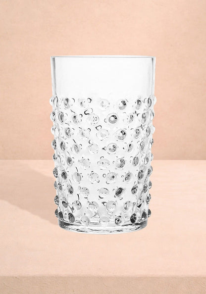 Set of four clear Dew Drop tumblers by Casa Josephine Jenno, modern glass drinking glasses with rounded, textured design.