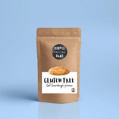 Gluten-free oat bread premix from Simple Bake, showing the dry bread mix in a clear bag with oats and baking ingredients.