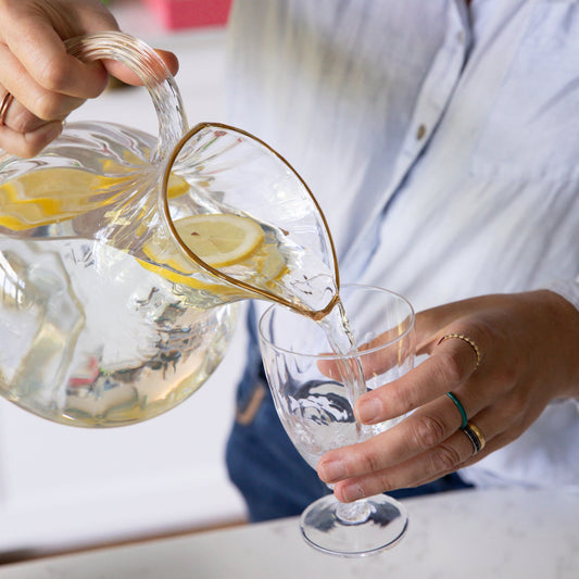 Large crystal water jug with elegant gold rim, designed by The Vintage List, showcasing its clear glass and luxurious gold accents.