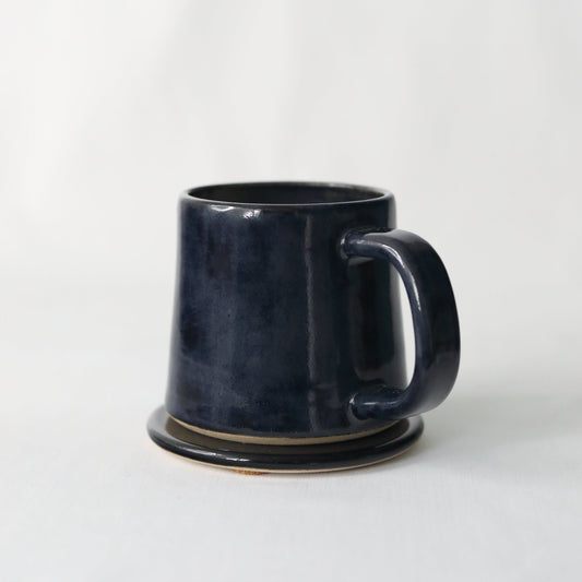 Handmade black ceramic coaster from Katie L Thompson Designs, Jet Black Classic Coasters with smooth finish.