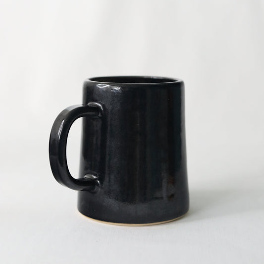 Handmade black ceramic pint mug by Katie L Thompson Designs with a classic Jet Black finish and sturdy handle.