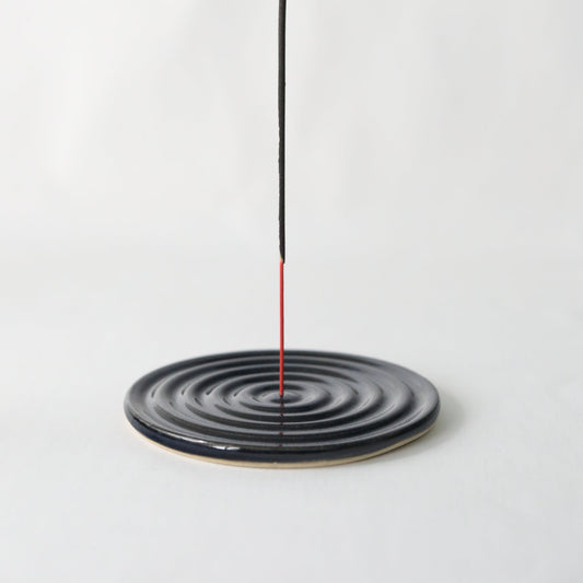 Handmade black ceramic incense burner by Katie L Thompson Designs, featuring a sleek jet black finish and intricate design details.