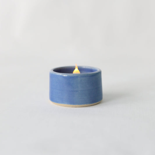Handmade Pacific Blue ceramic tea light holder by Katie L Thompson Designs, featuring a classic design for ambient candlelight.