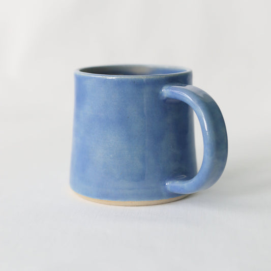 Handmade ceramic Pacific Blue Classic Standard Mug by Katie L Thompson Designs, featuring a smooth blue glaze and ergonomic handle.