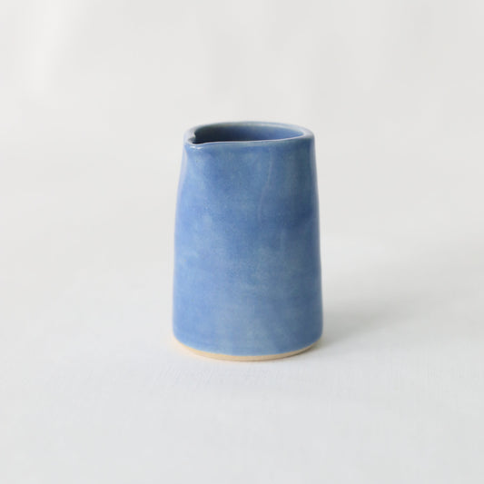 Handmade Pacific Blue ceramic mini jug by Katie L Thompson Designs, featuring a classic small jug with a smooth blue glaze.