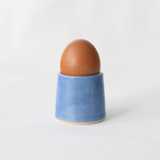 Handmade blue ceramic Pacific Blue Classic Egg Cup by Katie L Thompson Designs, featuring a smooth, glossy finish and elegant design.