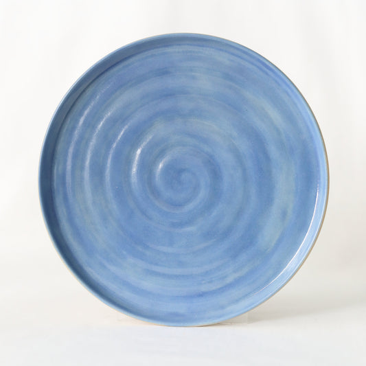Handmade Pacific Blue ceramic side plate by Katie L Thompson Designs, featuring a classic round shape and vibrant blue glaze.