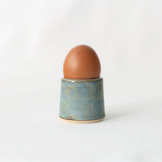 Handmade seafoam blue ceramic egg cup by Katie L Thompson Designs, featuring a classic, smooth, rounded shape for breakfast.