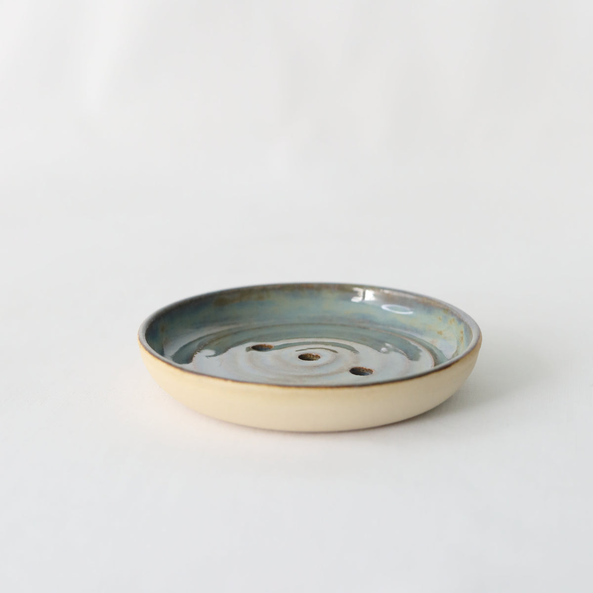 Handmade seafoam blue ceramic soap dish by Katie L Thompson Designs, featuring a classic, elegant design perfect for bathroom decor.