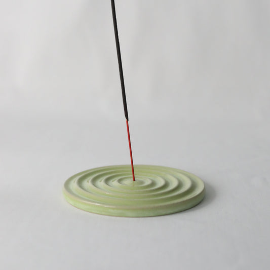 Handmade spring green ceramic incense burner by Katie L Thompson Designs, featuring a classic design for aromatic incense burning.