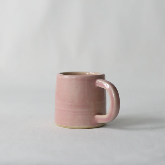 Handmade blush pink ceramic espresso mug by Katie L Thompson Designs, featuring a classic shape and smooth finish.