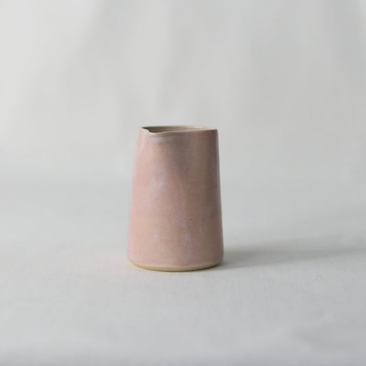 Handmade blush pink ceramic mini jug by Katie L Thompson Designs, featuring a classic small jug with a smooth finish.