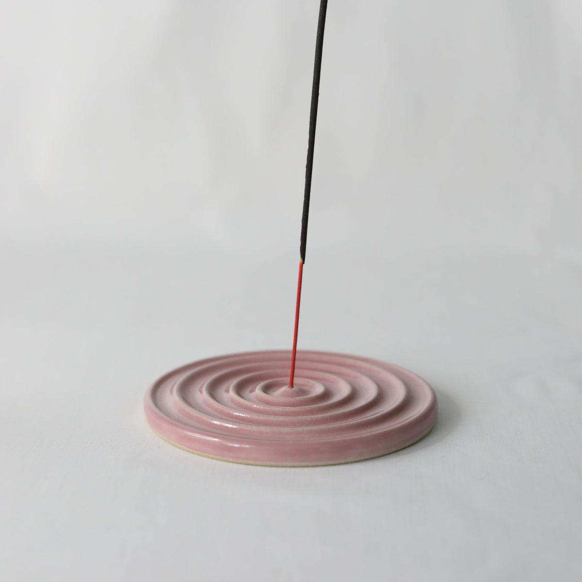 Handmade blush pink ceramic incense burner with a classic design by Katie L Thompson Designs.
