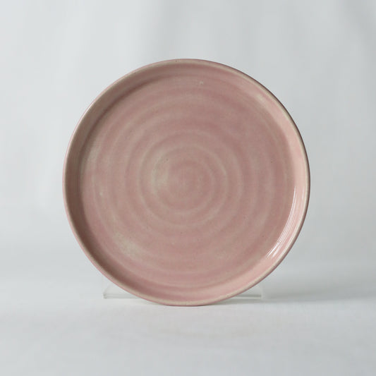 Handmade blush pink ceramic cake plate by Katie L Thompson Designs, featuring a classic elegant design for serving desserts.