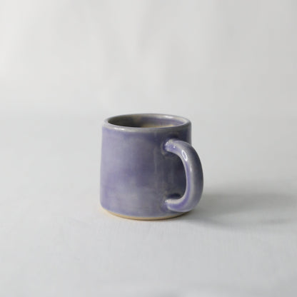 Handmade purple ceramic espresso mug by Katie L Thompson Designs, featuring a classic amethyst purple finish.