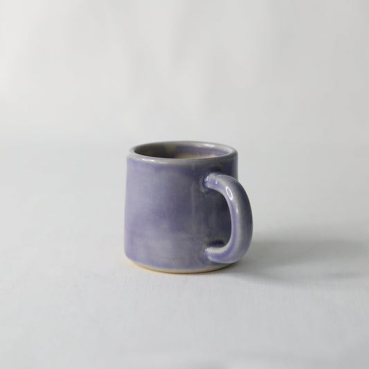 Handmade purple ceramic espresso mug by Katie L Thompson Designs, featuring a classic amethyst purple finish.
