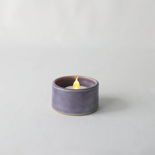 Handmade purple ceramic tea light holder with amethyst-inspired design by Katie L Thompson Designs.