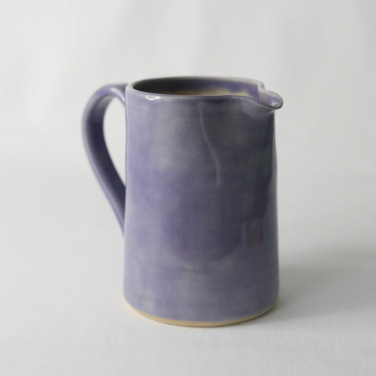 Handmade amethyst purple ceramic large jug by Katie L Thompson Designs, showcasing its elegant shape and vibrant color.