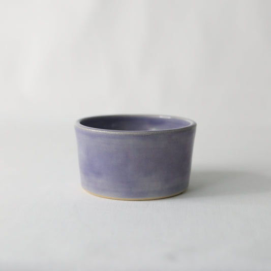 Handmade amethyst purple ceramic side bowl by Katie L Thompson Designs, showcasing a smooth, rounded design perfect for serving.