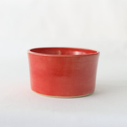 Cherry red ceramic side bowl by Katie L Thompson Designs, handmade with a classic round shape and glossy finish.