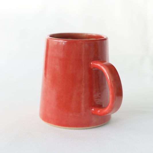 Cherry red ceramic pint mug by Katie L Thompson Designs, handmade with a classic style and smooth finish.