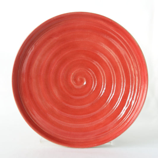 Cherry red ceramic side plate by Katie L Thompson Designs, showcasing a handmade, vibrant red ceramic design.