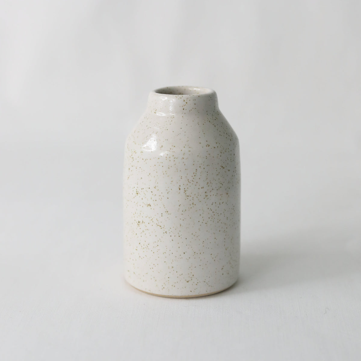 Handmade white ceramic Pepper White Classic Reed Diffuser by Katie L Thompson Designs with natural reed sticks.