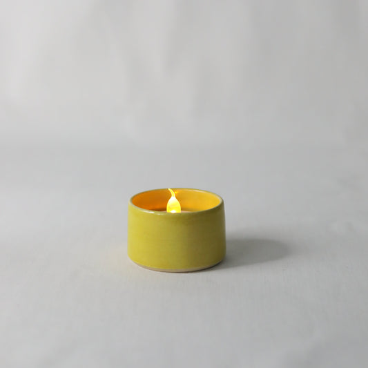 Handmade sun yellow ceramic tea light holder by Katie L Thompson Designs, featuring a classic and elegant design.