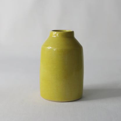 Handmade sun yellow ceramic Bud Vase by Katie L Thompson Designs, showcasing a classic, smooth ceramic finish and elegant shape.