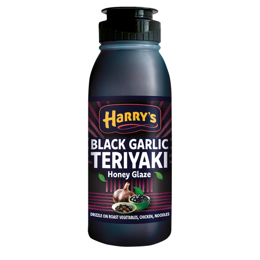 Harry's Hot Honey Black Garlic Teriyaki Glaze bottle with dark, rich glaze and garlic bits visible inside the glass bottle.