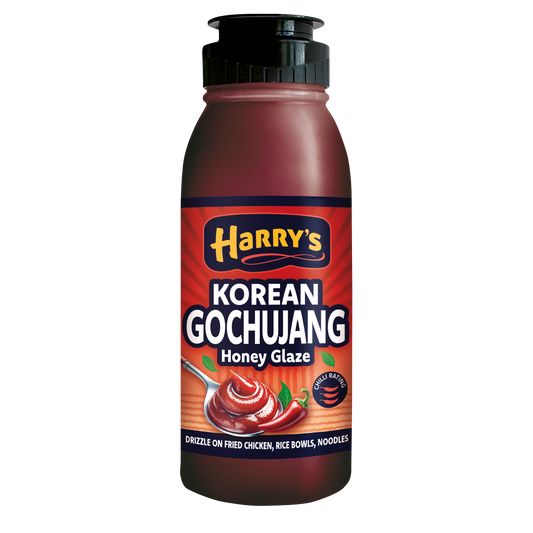 Bottle of Harry's Hot Honey Korean Gochujang Honey Glaze, spicy-sweet sauce with red chili and honey in a clear glass bottle