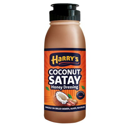 Bottle of Harry's Hot Honey Coconut Satay Honey Dressing with a clear label and golden honey color.