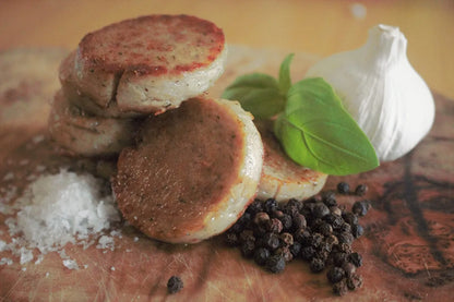 White Hogs Pudding by Primrose Herd, cooked and sliced, showcasing its creamy texture and traditional British breakfast style.