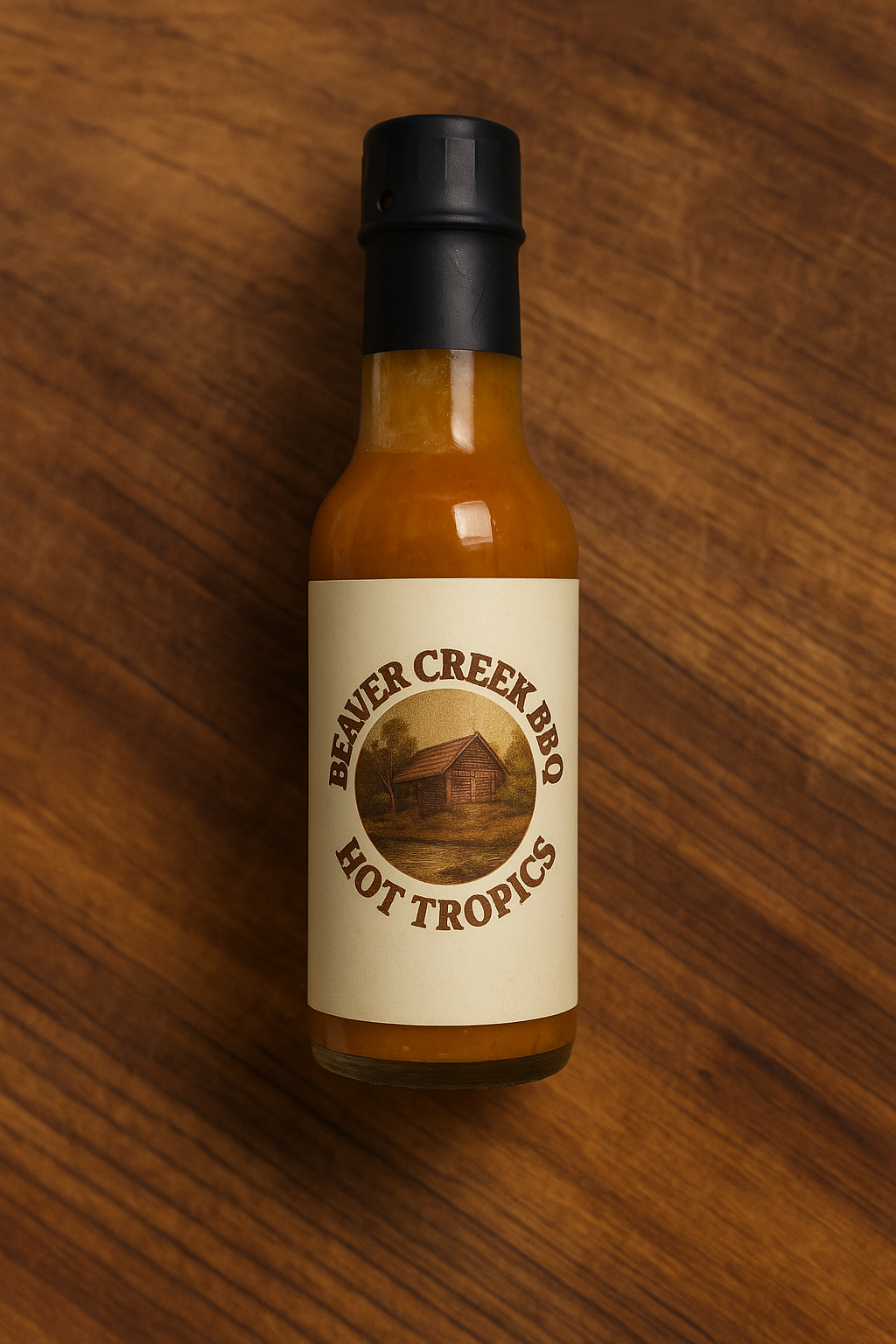 Beaver Creek BBQ Hot Tropics hot sauce bottle with colorful label, front view showcasing the spicy hot sauce product.