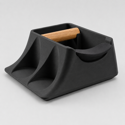 Charcoal KNOCDIC® Hub coffee knock box and tamper holder with tamping station for espresso preparation.