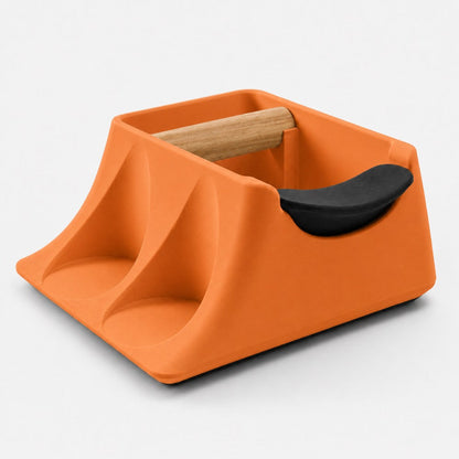 Orange KNOCDIC® Coffee Knock Box and Tamper Holder with tamping station for espresso preparation and coffee accessories.