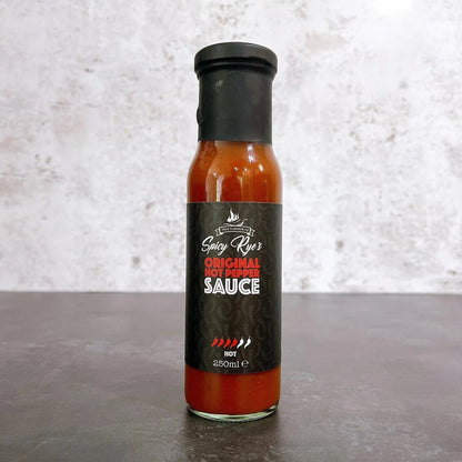 Spicy Ryes Original Hot Pepper Sauce bottle with bright red label and fiery hot sauce inside, ready to add heat to dishes.