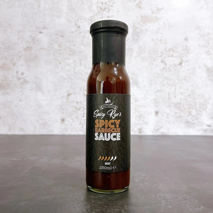Spicy Ryes hot BBQ sauce in a glass bottle with red chili peppers and smoky flavor hints, ready for grilling and dipping.
