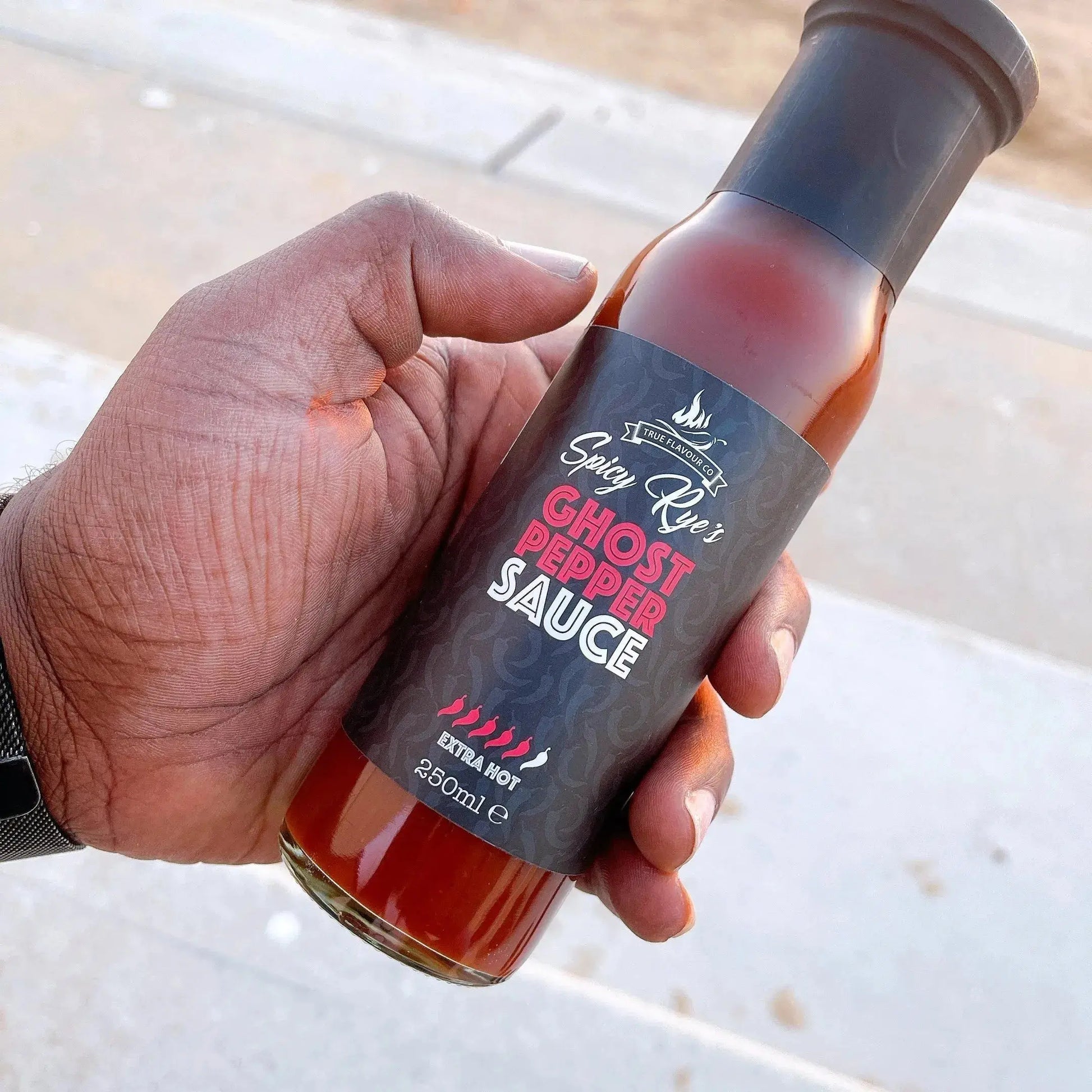 Spicy Ryes Ghost Pepper Hot Sauce bottle with fiery label and cap, showcasing the intense ghost pepper flavor and vibrant packaging.