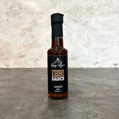 Spicy Ryes Bourbon & Honey BBQ Sauce bottle, marinade and grilling sauce with rich amber color and label details.