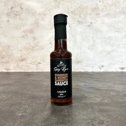 Spicy Ryes Bourbon & Honey BBQ Sauce bottle, marinade and grilling sauce with rich amber color and label details.